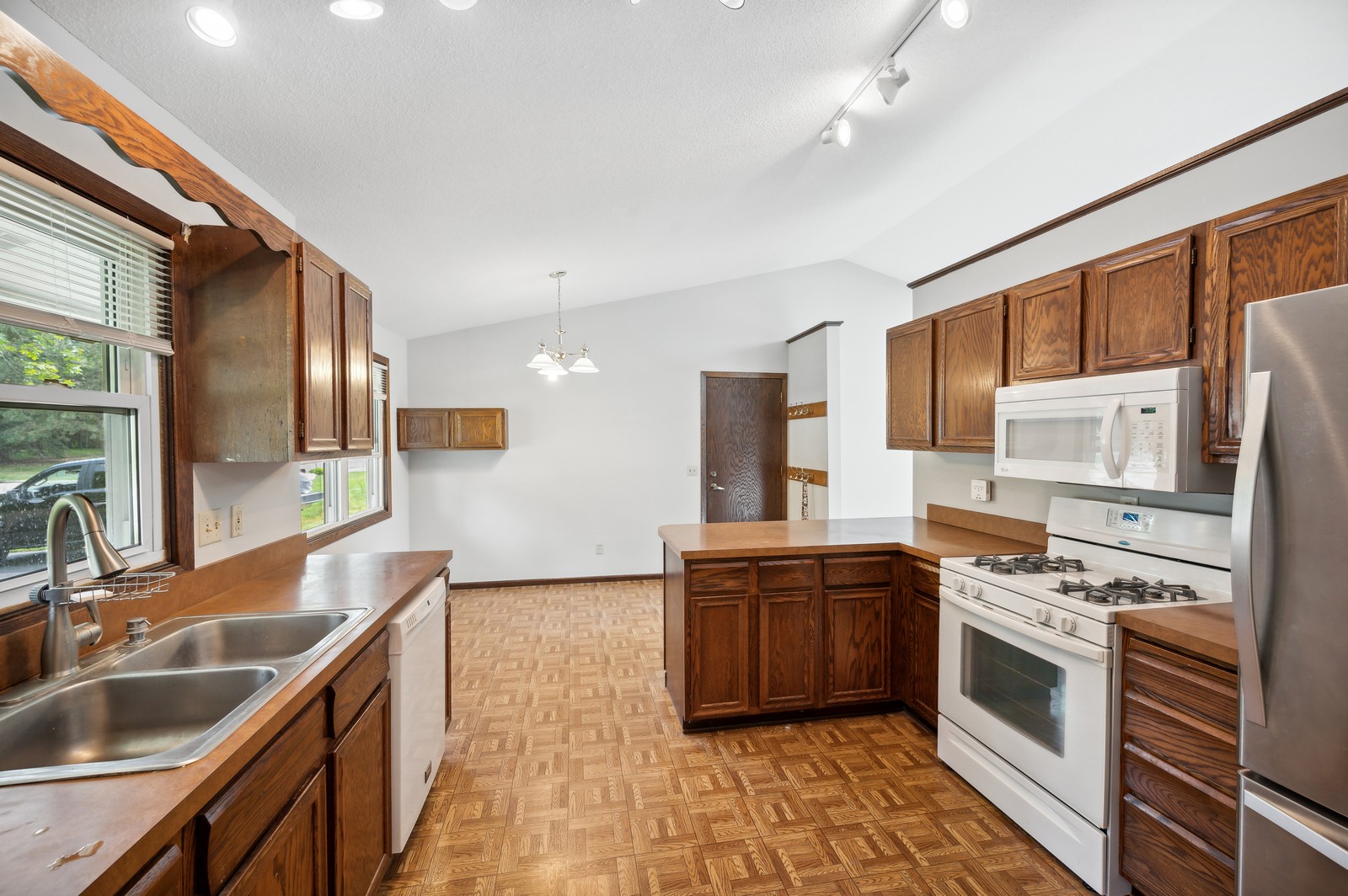 Modern kitchen at Blossom Hill Assisted Living in Woodbury, MN, with stainless steel appliances and ample counter space